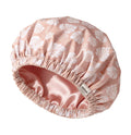 YANIBEST Butter Satin Lined Waterproof Shower Cap in Pink Leaves pattern, featuring a white cap with chic pink leaf print and a soft satin lining.