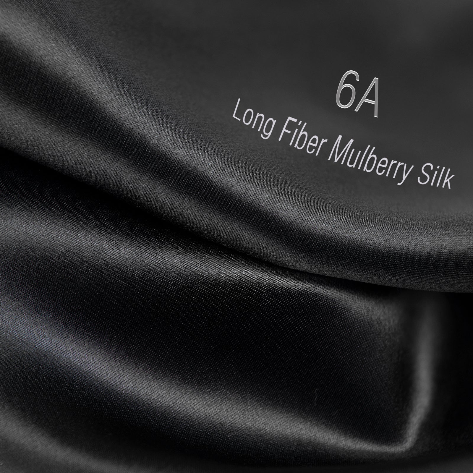 Black 6A long fiber mulberry silk fabric close-up with smooth, shiny texture