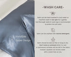 Dream blue satin pillowcase with invisible zipper, wash care instructions on side