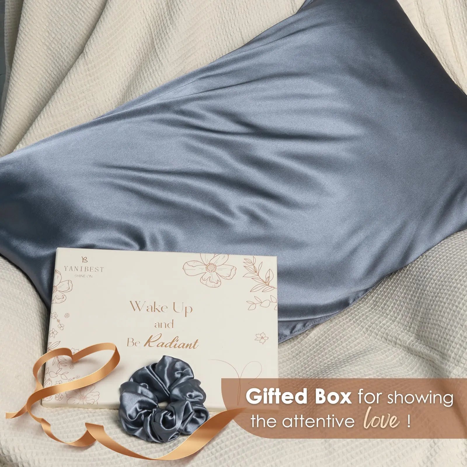 Dream blue satin pillowcase with matching scrunchie, gift box, and ribbon on cream bedding