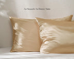 Golden champagne satin pillowcases set on a bed with smooth, shiny finish