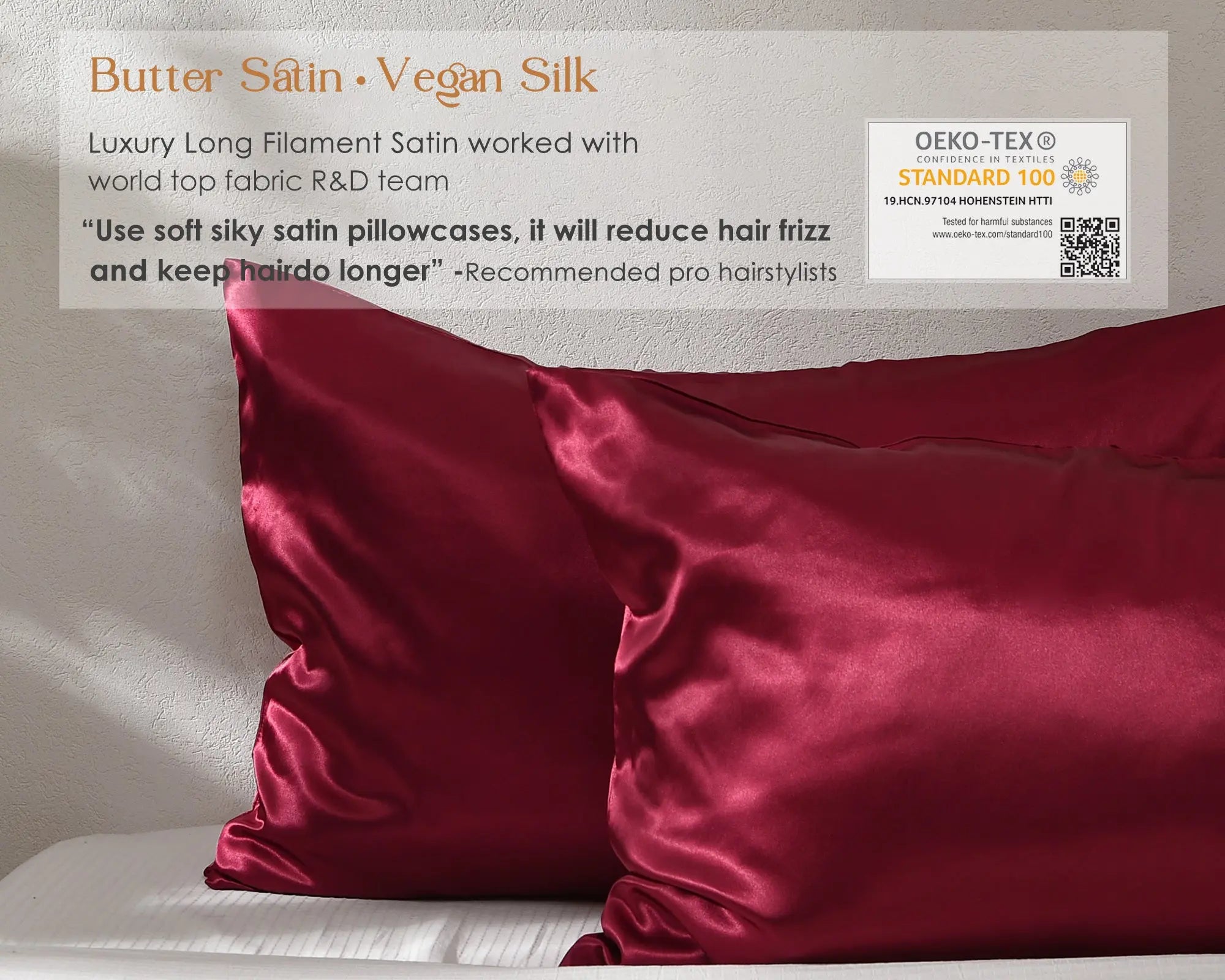 Luxury red satin pillowcases set on white bed, smooth and shiny vegan silk texture