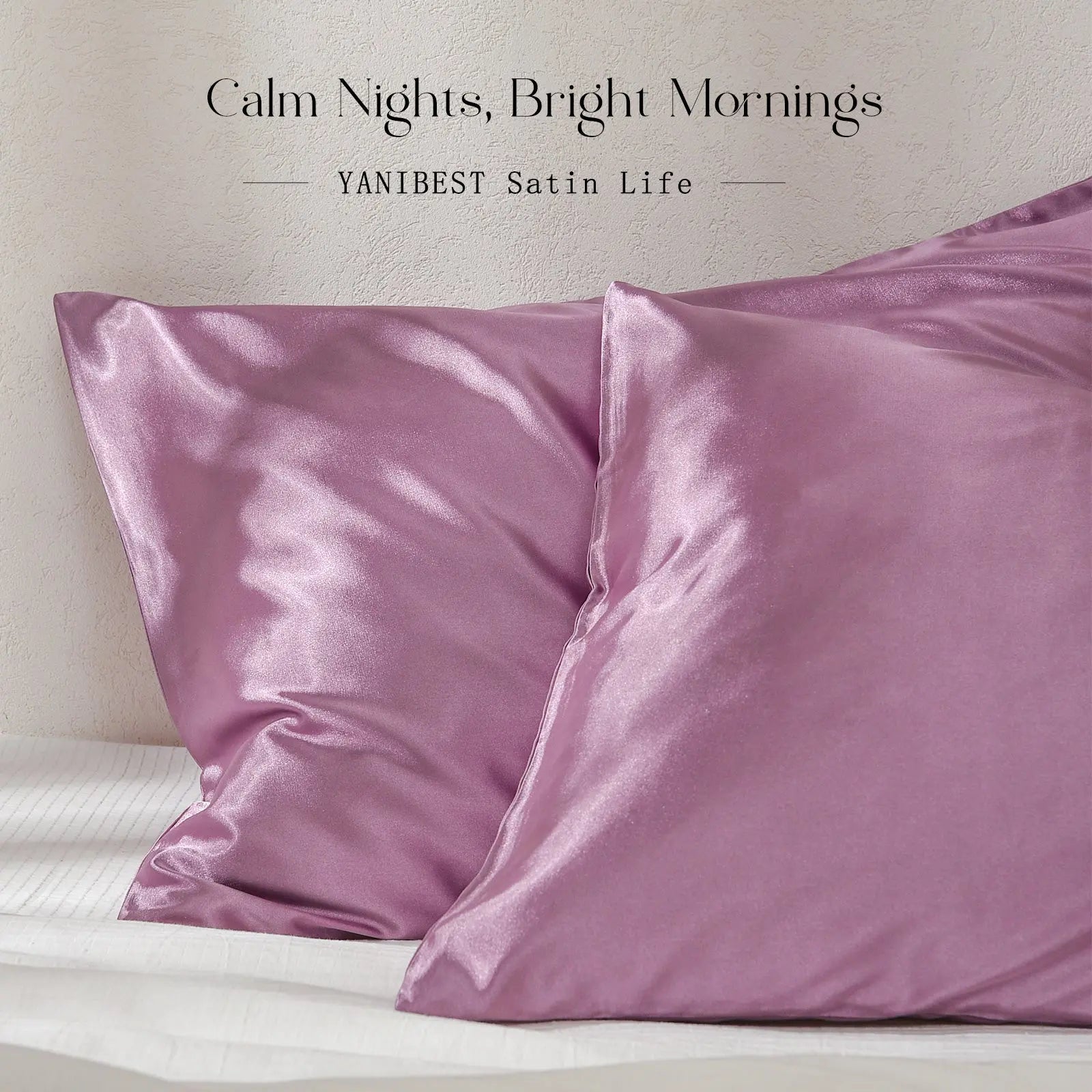 Pair of marve purple satin pillowcases on a bed with a soft fabric sheen