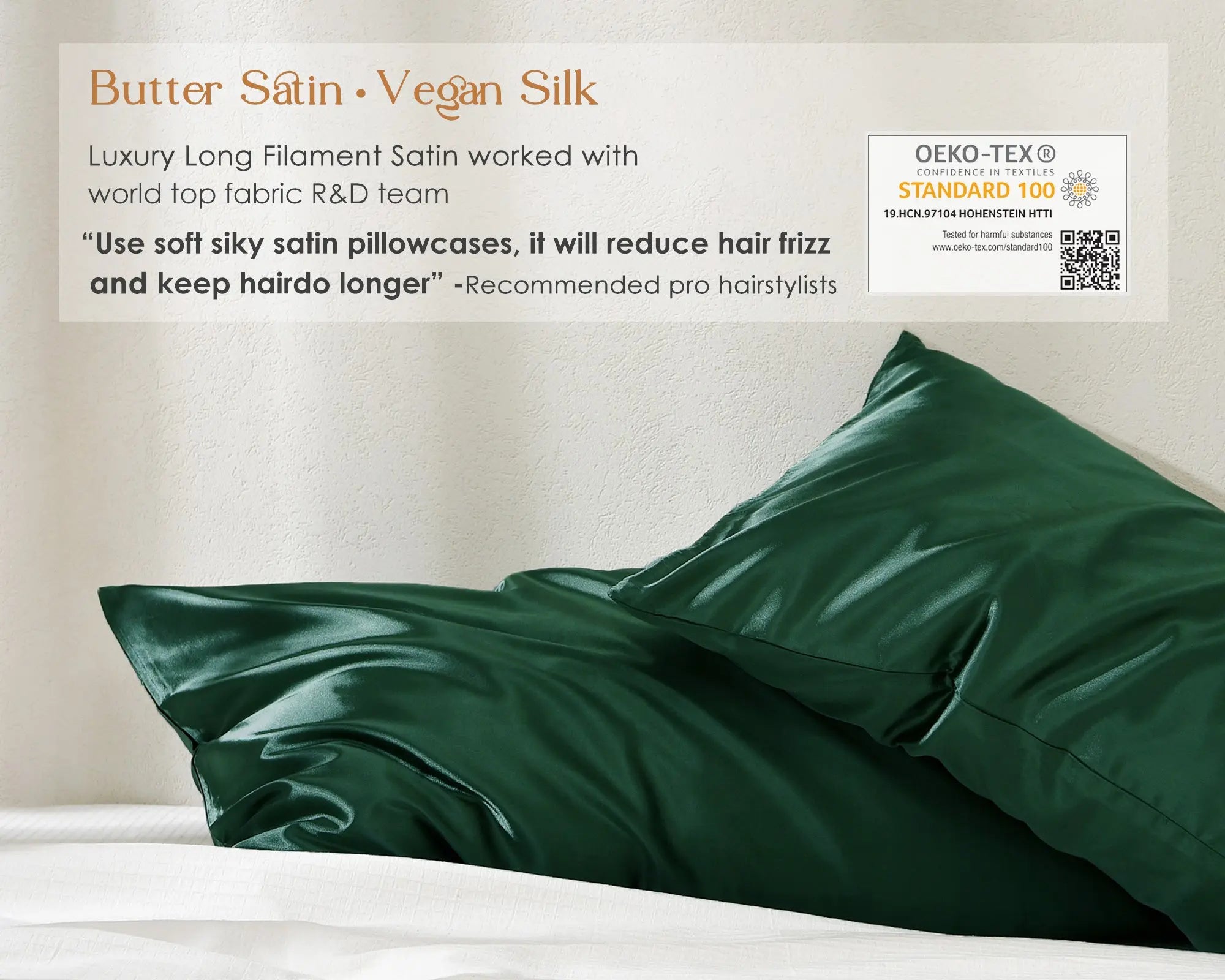 Olive green satin pillowcases set of two displayed on a white bed against a neutral wall.