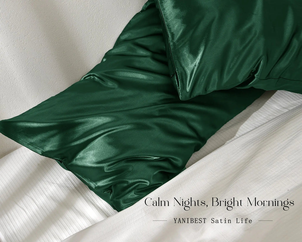 Olive green satin pillowcases set on a white bed, smooth and shiny texture