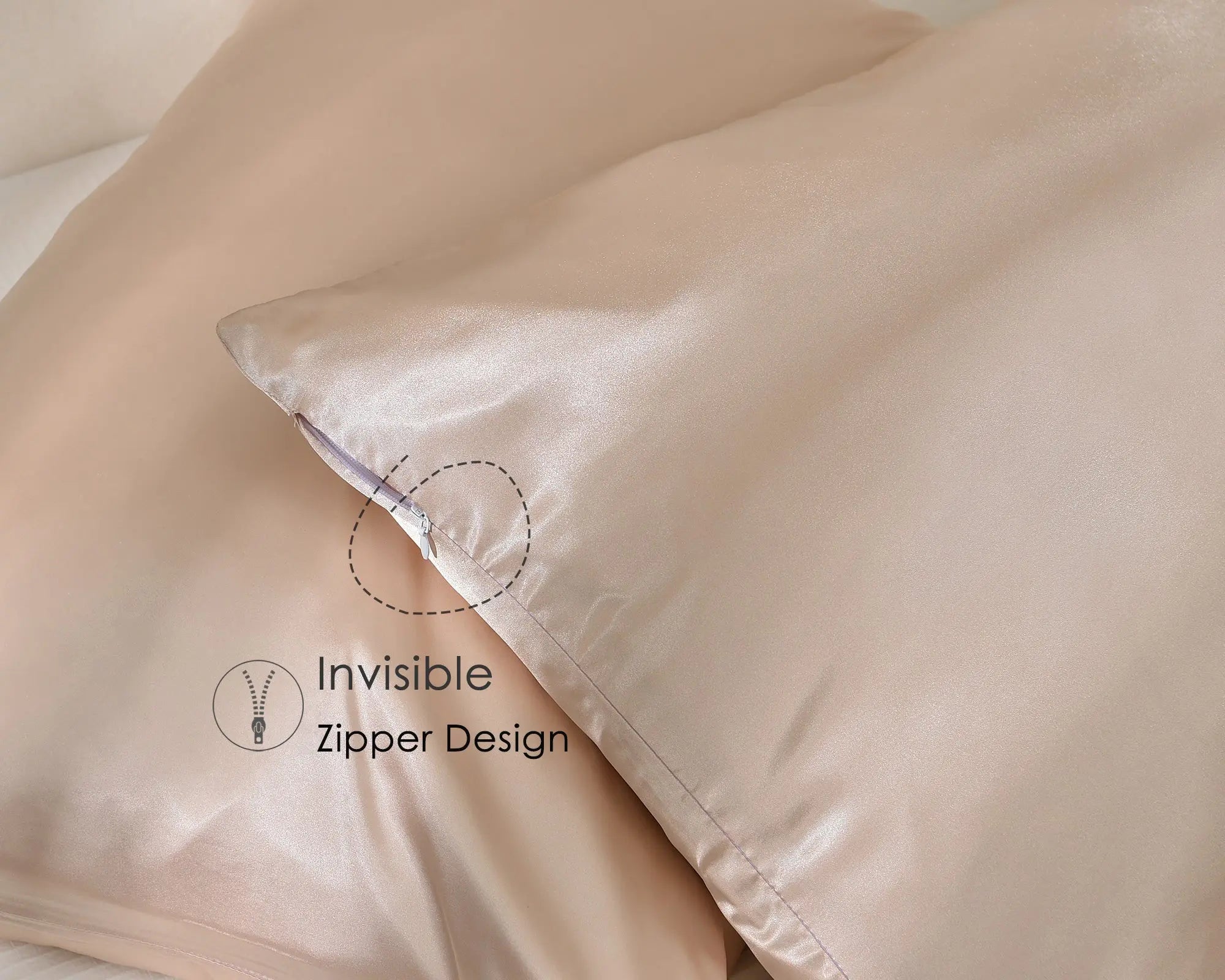 Rose gold satin pillowcases with invisible zipper, set of two, on a bed
