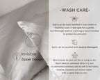 Silver gray satin pillowcase with invisible zipper, care instructions beside pillow