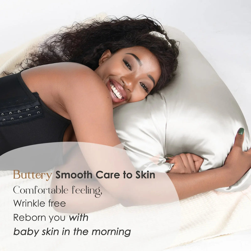 Woman smiling and lying on a silver gray satin pillowcase, promoting smooth wrinkle-free skin care benefits.