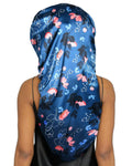 Long satin bonnet with blue and pink floral pattern on person wearing black top
