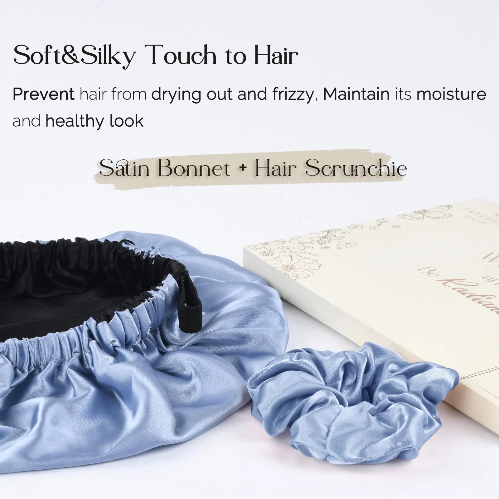 Sky blue reversible satin bonnet with matching scrunchie on white surface, soft hair care accessories