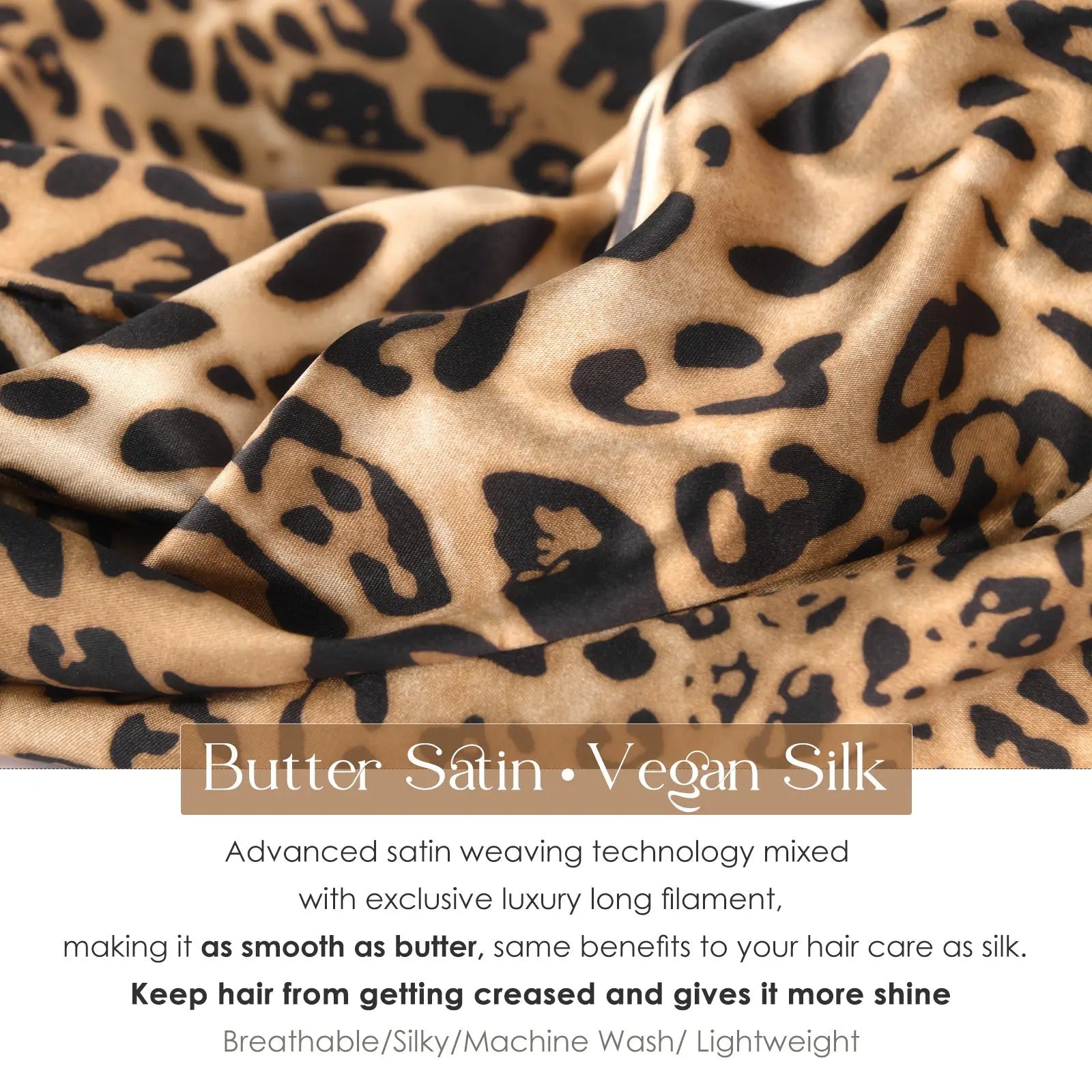 Close-up of satin fabric in a leopard print pattern, featuring a silky, shiny texture.