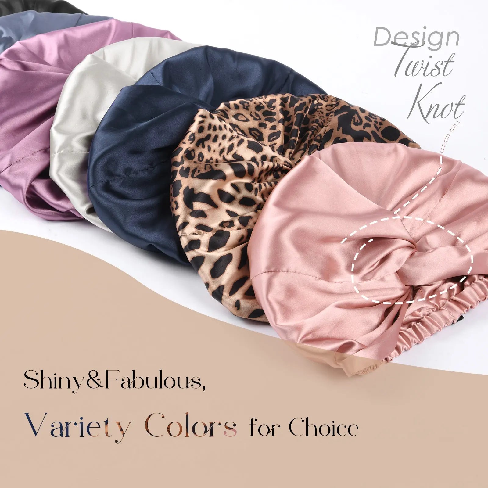 Assorted satin knotted turbans in pink, leopard print, navy, silver, and lavender colors.