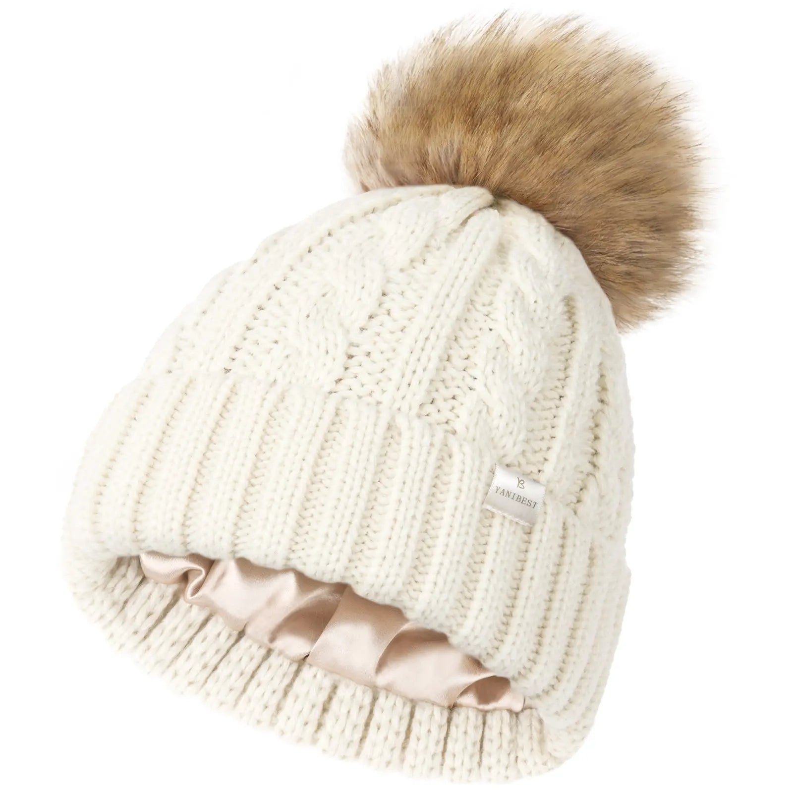 Cream white satin-lined winter beanie with faux fur pom pom and cable knit design