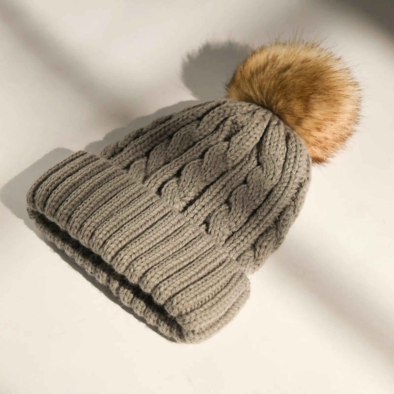 Gray cable knit beanie with faux fur pom pom, thick ribbed fold-over brim, winter hat
