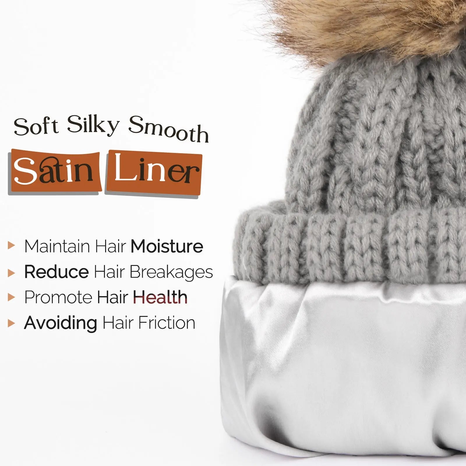 Gray winter beanie with satin lining and faux fur pom, promotes hair moisture and health.