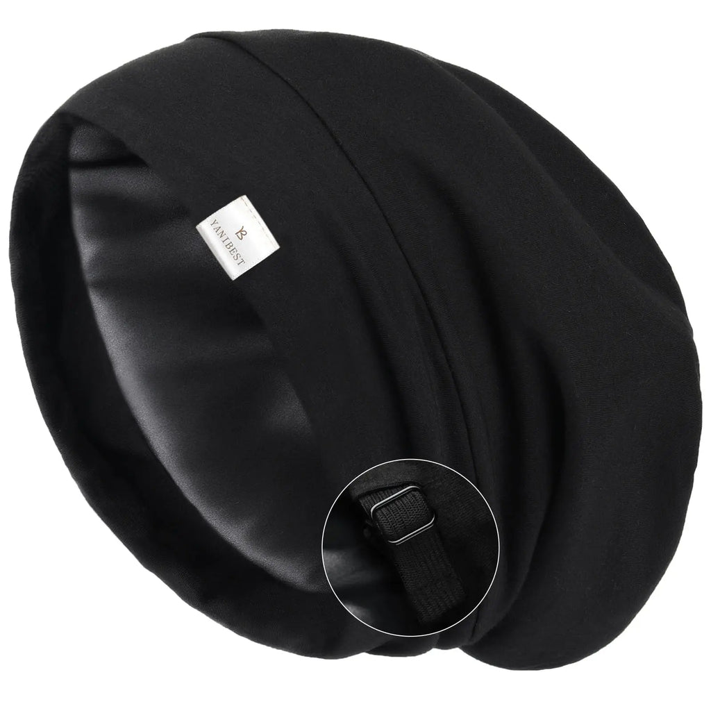 Black satin-lined slouchy sleep cap with adjustable strap close-up view