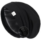 Black satin-lined slouchy sleep cap with adjustable strap close-up view