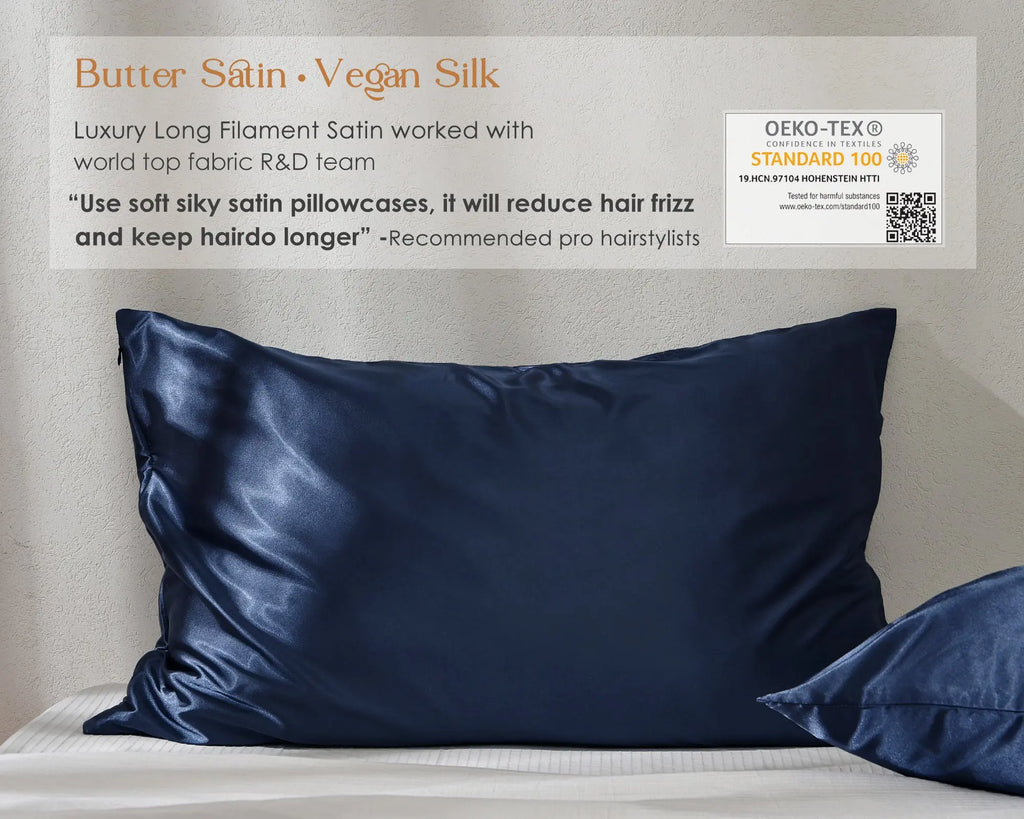 Ocean blue satin pillowcases on a bed with textured wall, soft and smooth finish