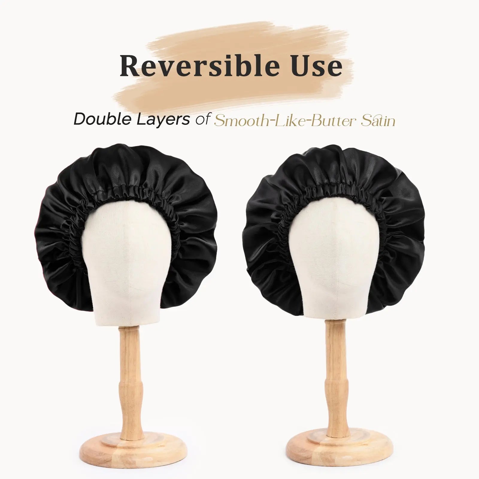 Black reversible satin bonnet with double layers displayed on two mannequin heads