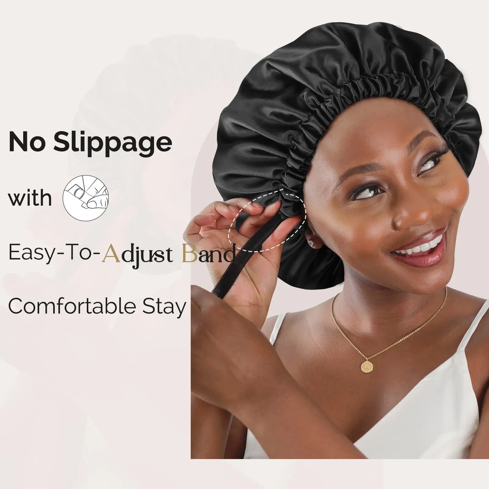 Smiling woman adjusting black satin sleep bonnet with easy-to-adjust band for comfortable fit